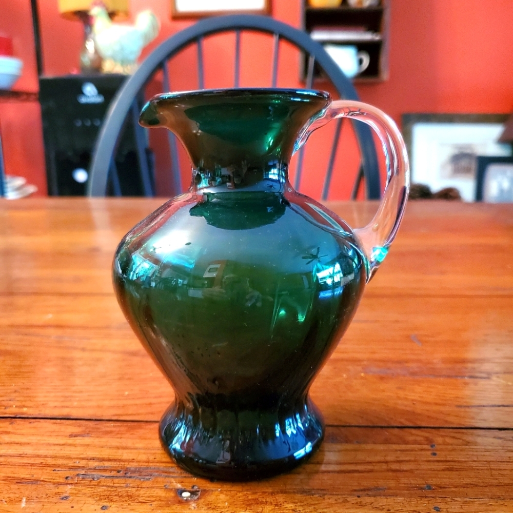 Hand-blown green glass pitcher